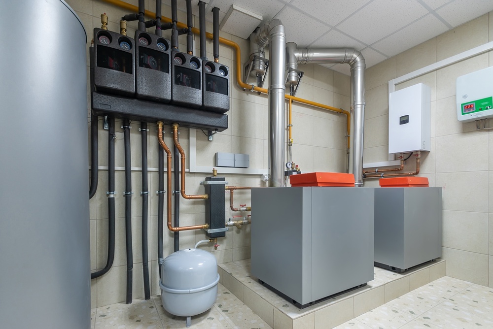 Technician servicing a home boiler
