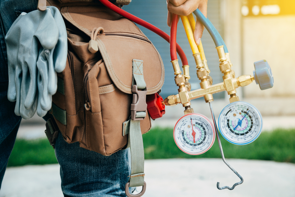 HVAC technician performing seasonal maintenance